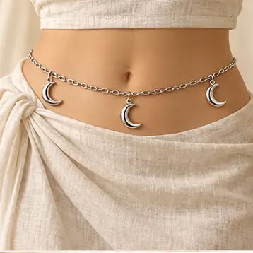 Luna Crescent Waist Chain worn over an ivory dress